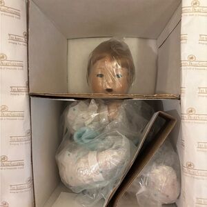 Porcelain Baby Doll in Blue Outfit